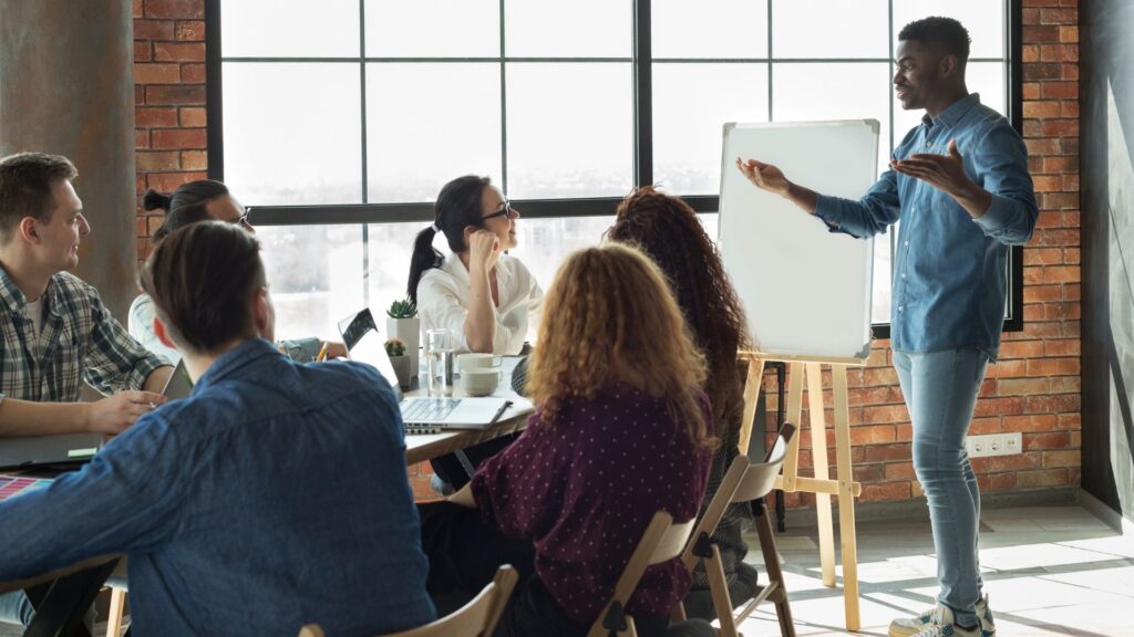 a man in speaking in a meeting